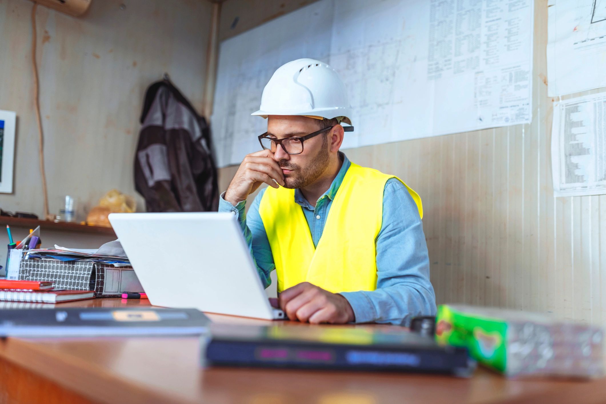 Engineer working on a laptop in an office