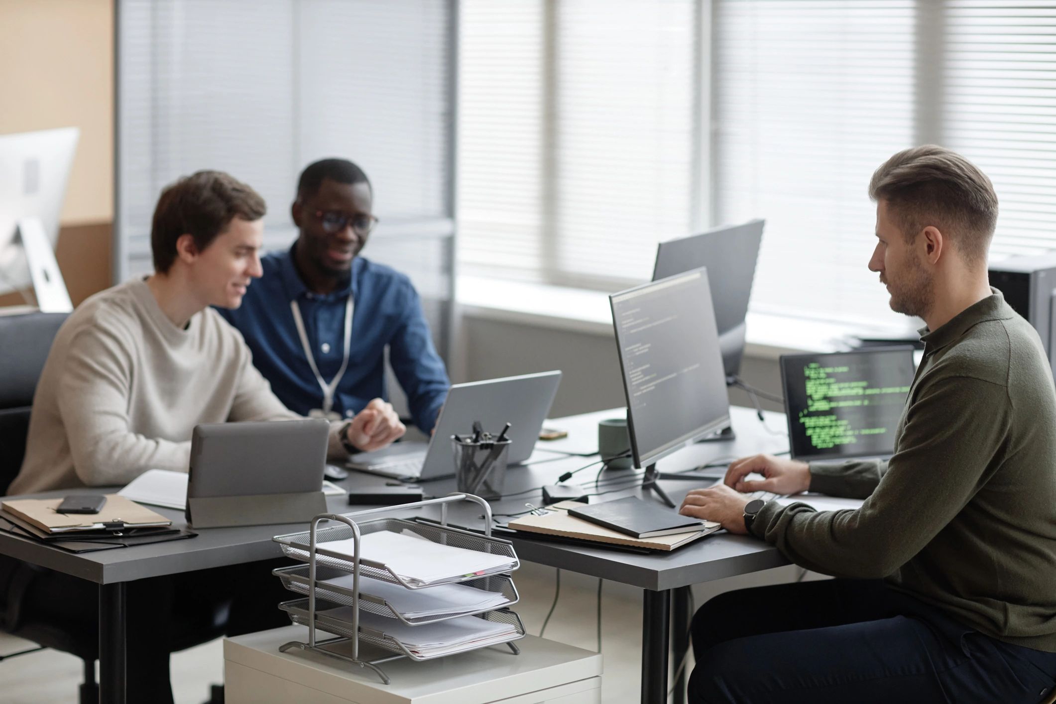 Technical team collaborating in a modern office